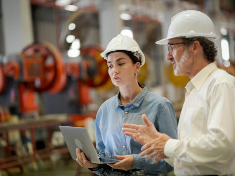 Photo of two people in an engineering setting