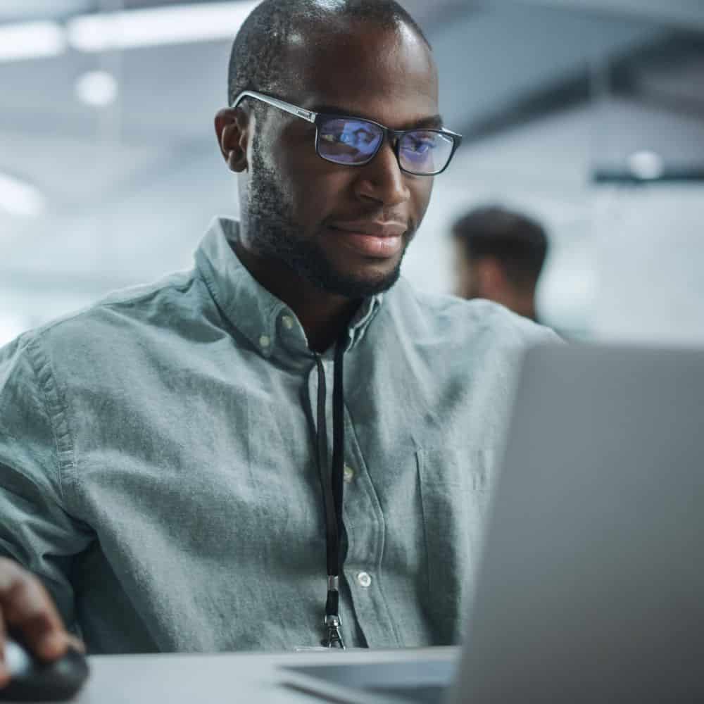 Carbon accountant sat in front of a laptop