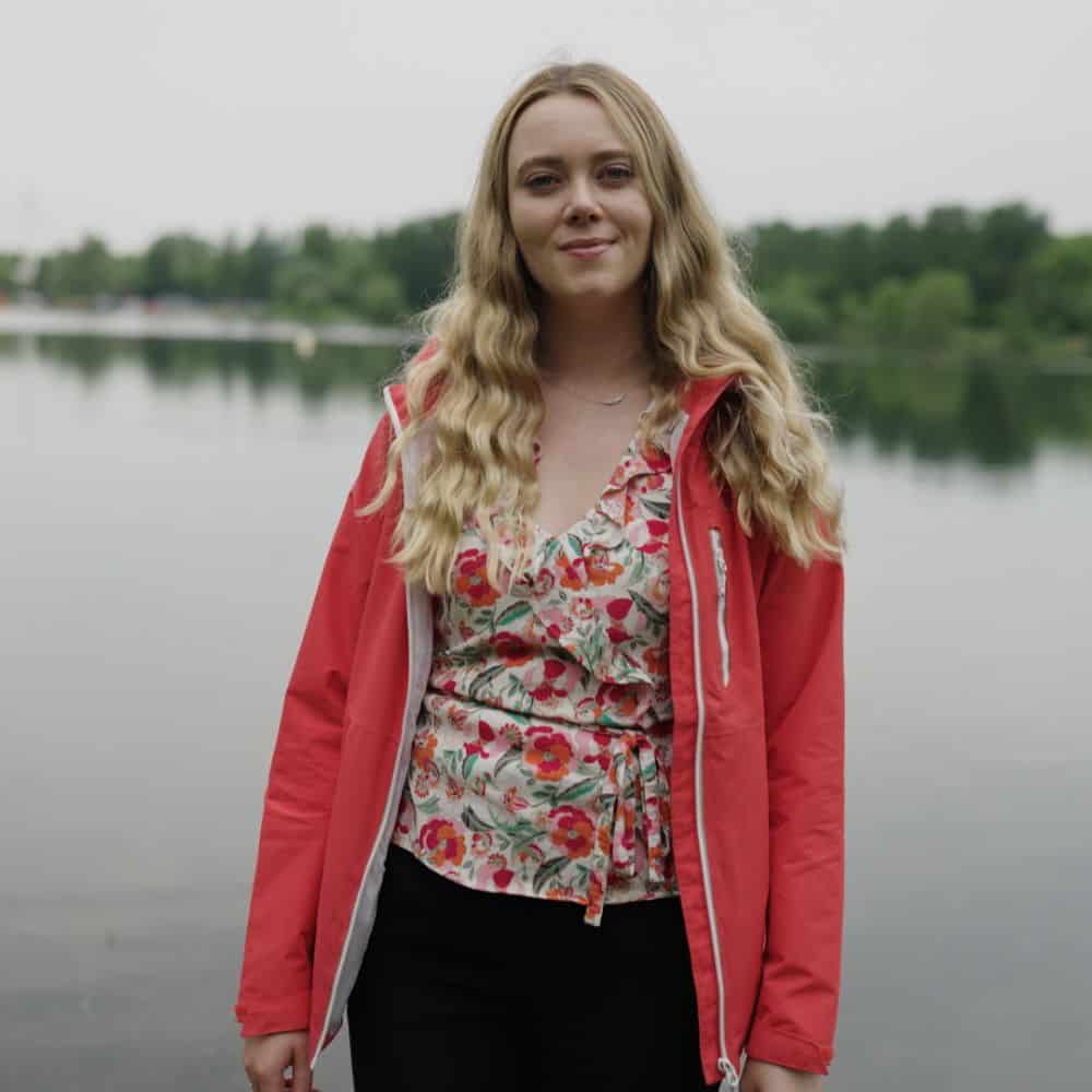 Photo of Nicole Walsh in front of a body of water