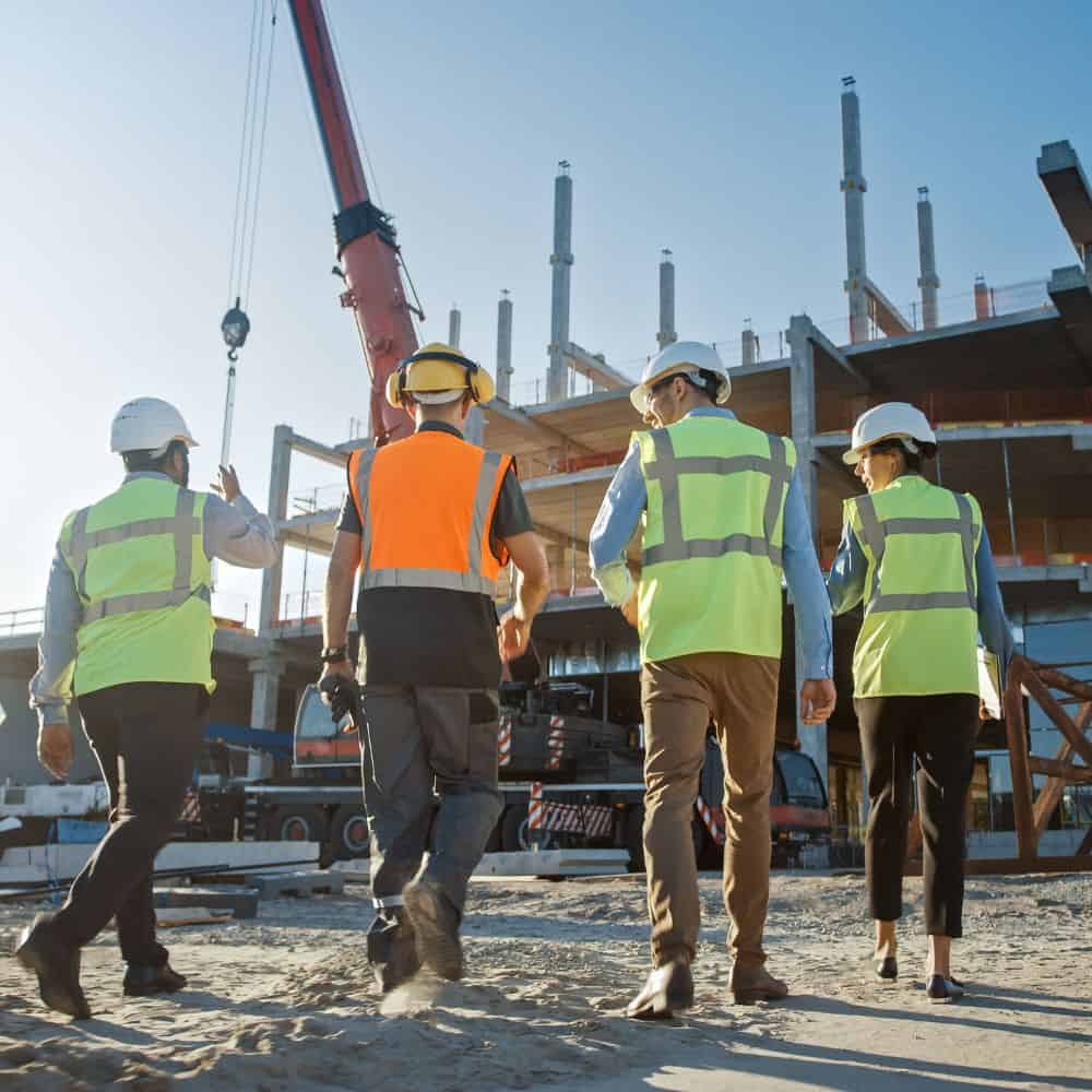 Image of four people on a construction site