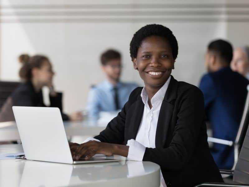 Woman sat at laptop in an office