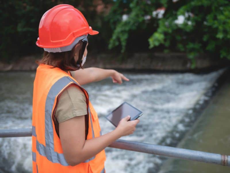 Hydrologist giving advice to a client about water flow