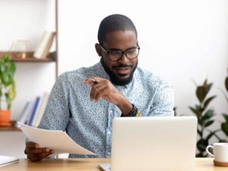 Sustainability analyst in front of laptop