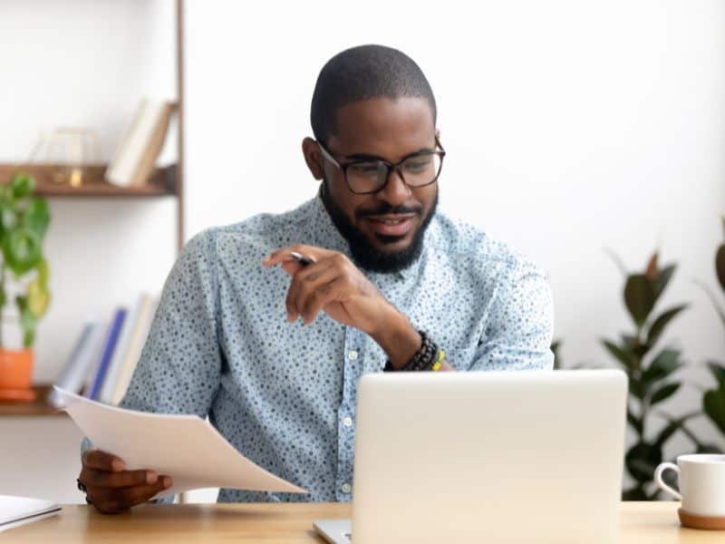 Sustainability analyst in front of laptop