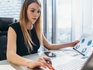 Sustainability analyst looking at charts