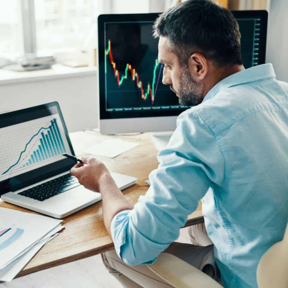 Sustainable finance analyst looking at graphs