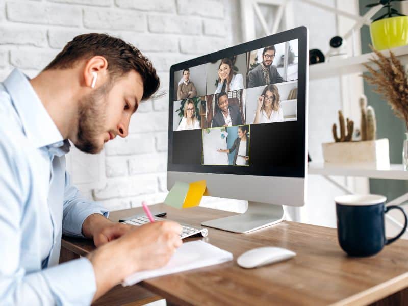 Image of man logged into call for online learning