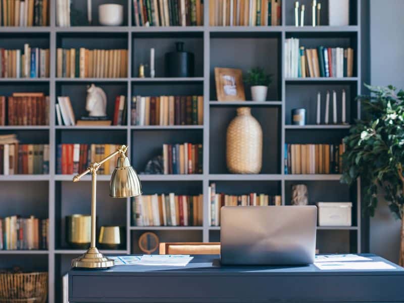 Home office with desk, computer and books