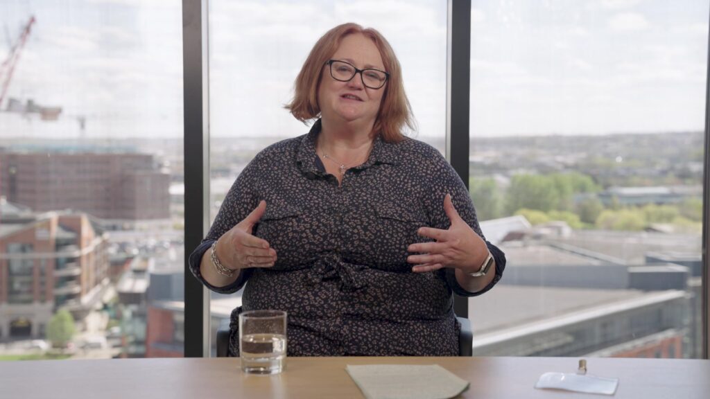 Canal & River Trust thought leadership video. Woman speaking to the camera, sat behind a table.