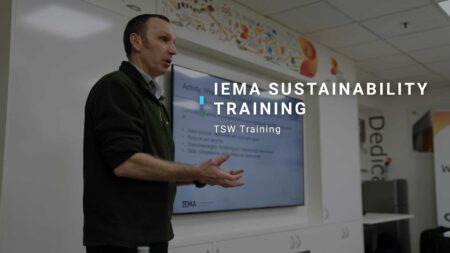 TSW video thumbnail. Image of man teaching in front of a screen in a classroom