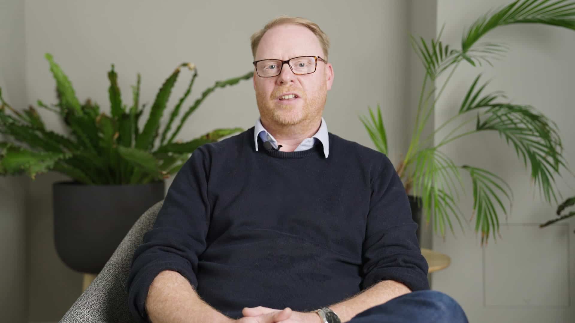 Temple thought leadership video thumbnail. Man sitting down talking to the camera