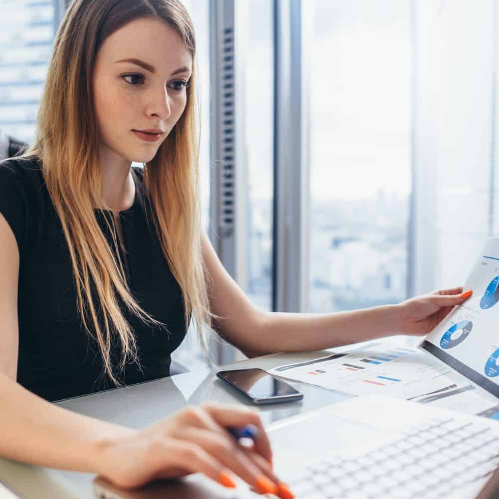 Sustainability analyst looking at charts