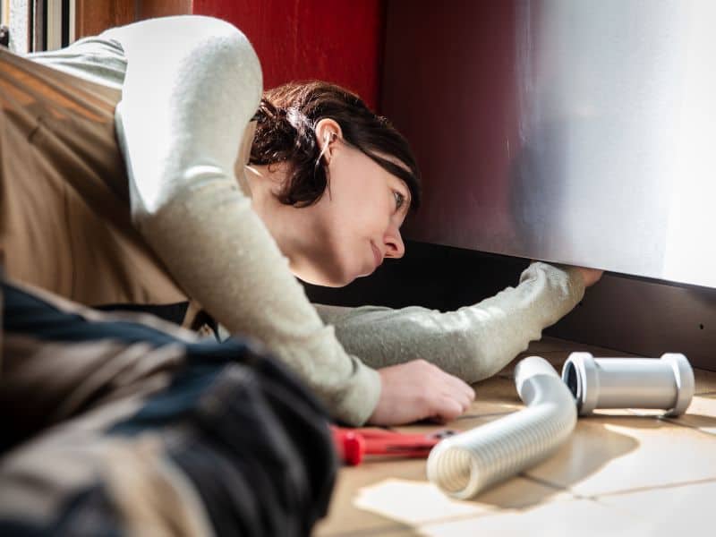 Photo of female plumber at work