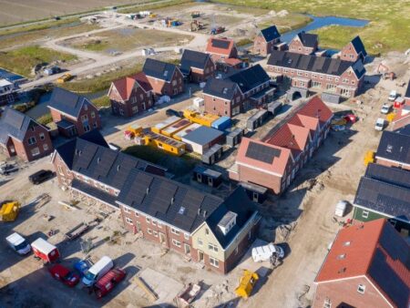Housing development in the process of being built, with solar panels on roofs