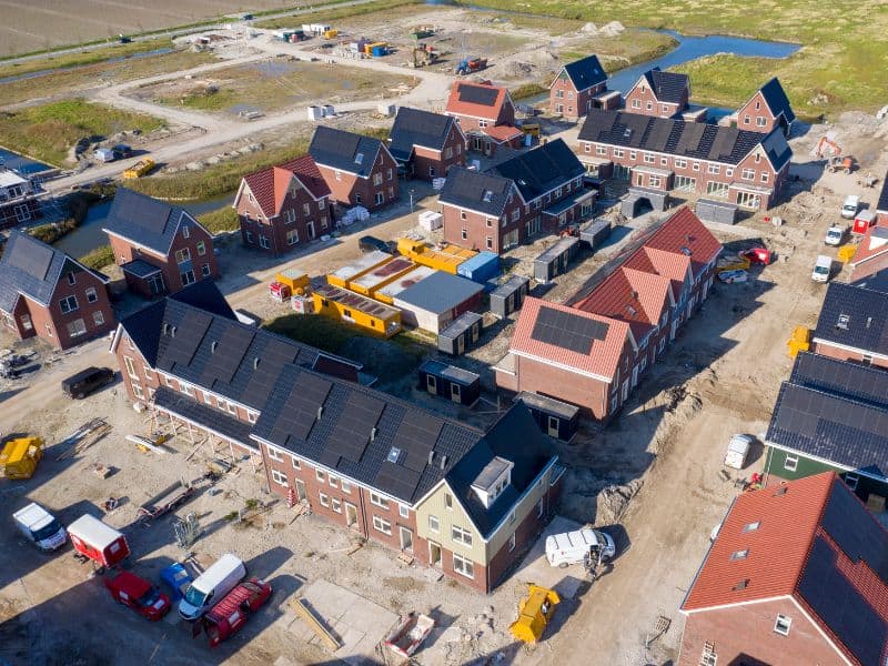 Housing development in the process of being built, with solar panels on roofs