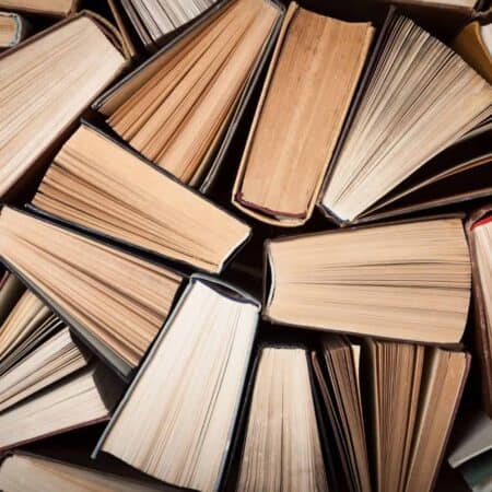 Photo of the sides of lots of books and pages