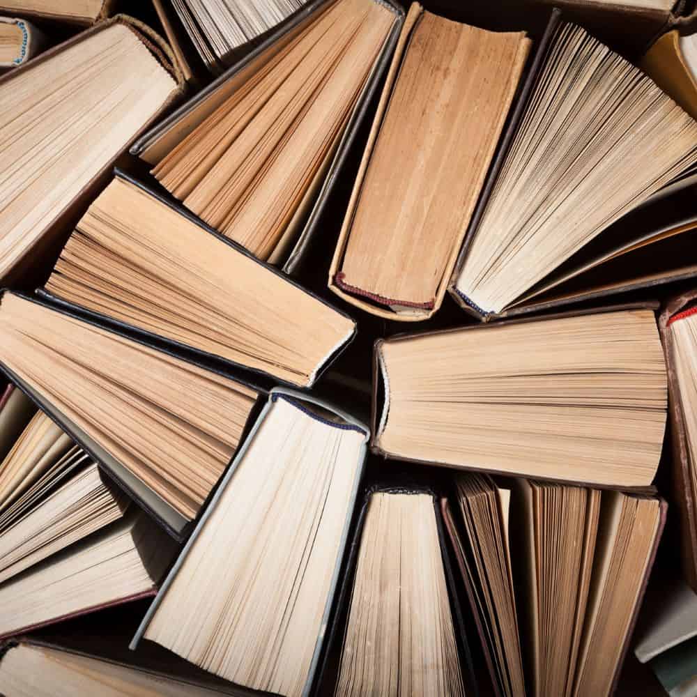 Photo of the sides of lots of books and pages