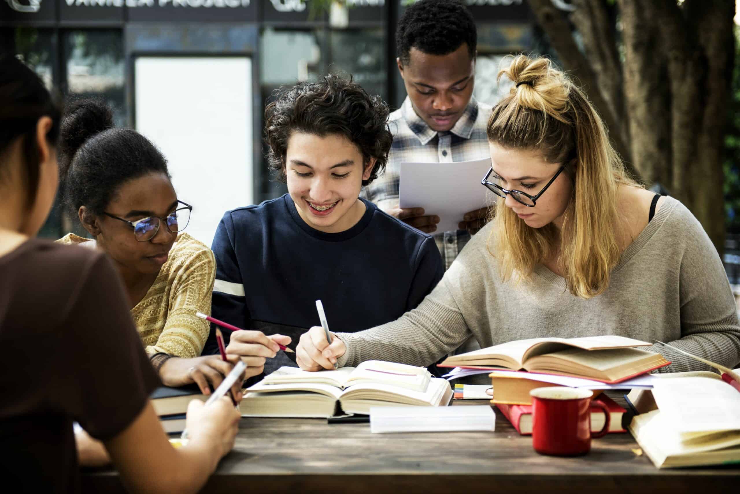 Four people working/studying at a table