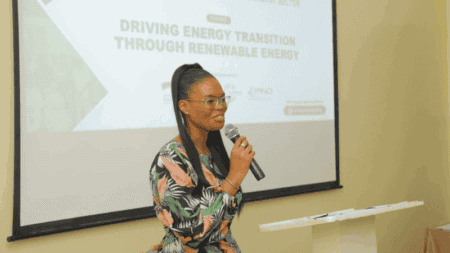 Photo of Oghosa presenting at a session