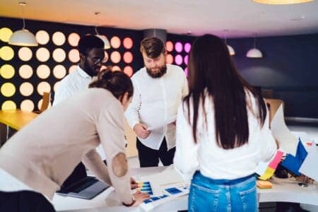 photo of people collaborating around a table