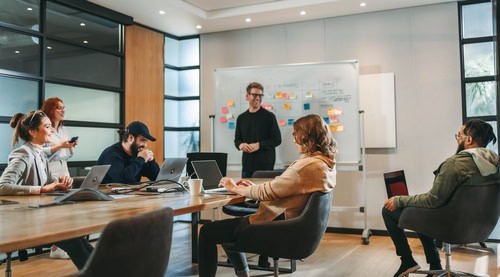 Group of people in a meeting room having a collaborative meeting