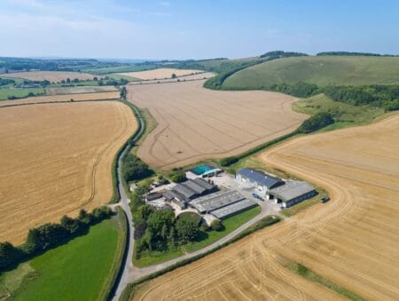 Aerial shot of farm buildings and fields