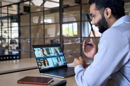 Man on an online meeting on his laptop