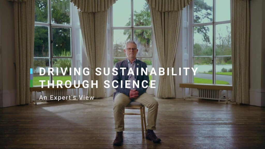 Photo of Phil talking to camera. title reads: driving sustainability through science