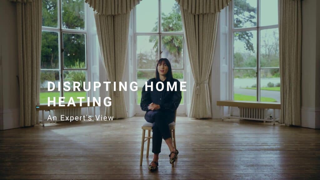 Photo of Pamela talking to the camera. Title reads: Disrupting home heating