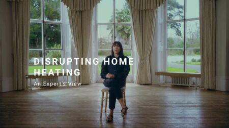 Photo of Pamela talking to the camera. Title reads: Disrupting home heating