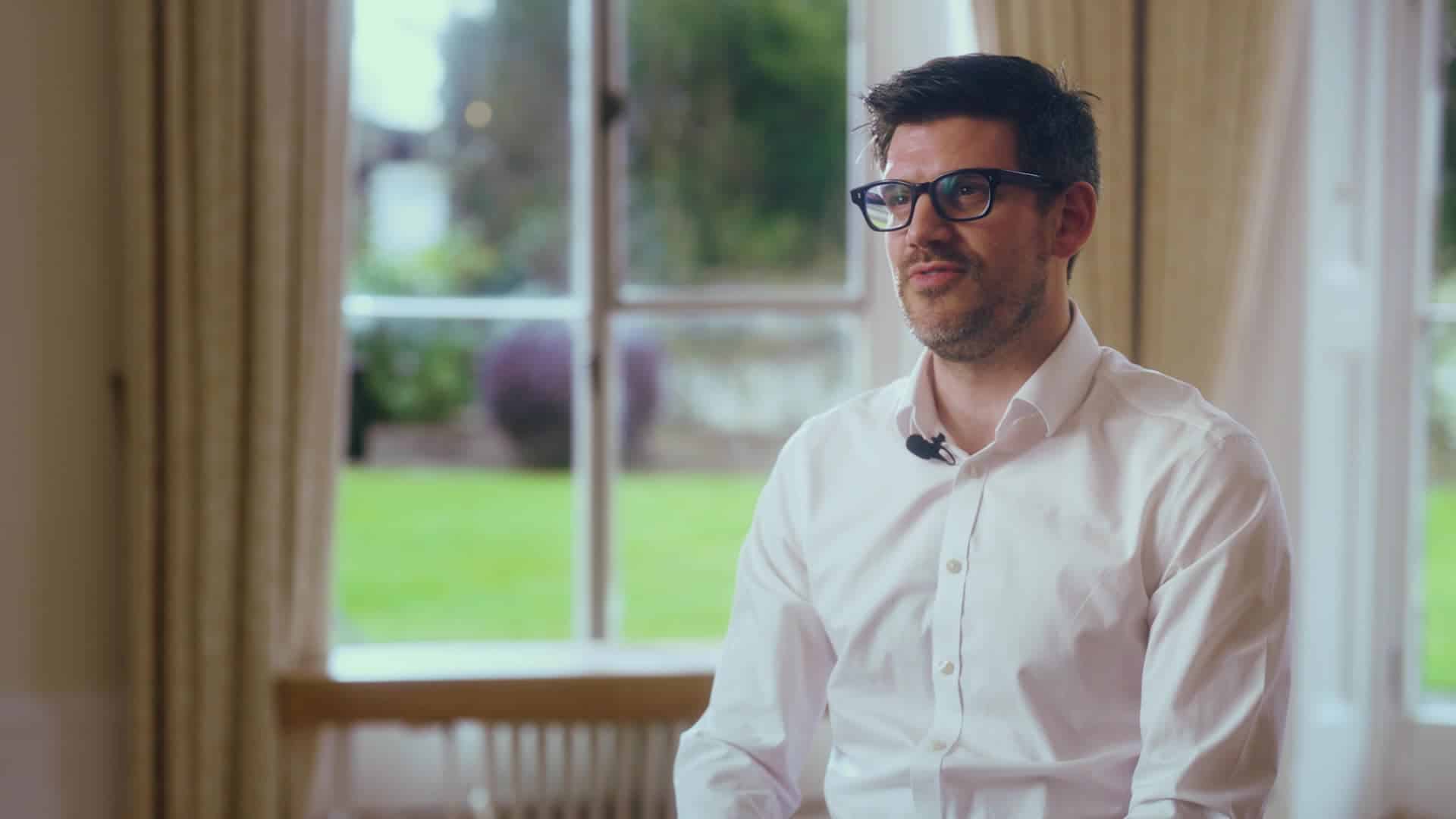 Photo of James speaking to camera