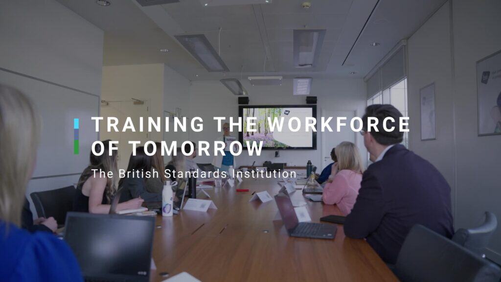 People in an office meeting room looking at a screen. Title reads: training the workforce of tomorrow