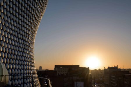 Photo of the sun rising in Birmingham with the Bullring in the foreground