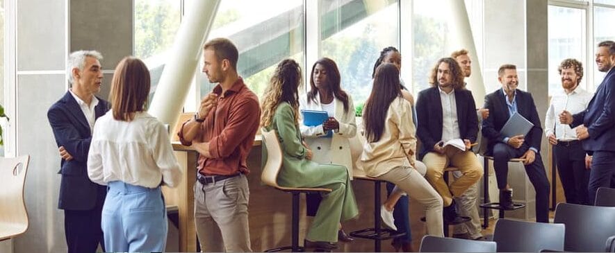 People sat down and talking in smaller groups