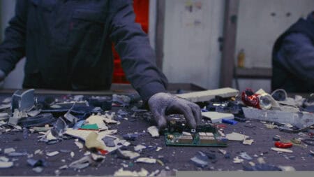 Person in front of a table with lots of materials on it