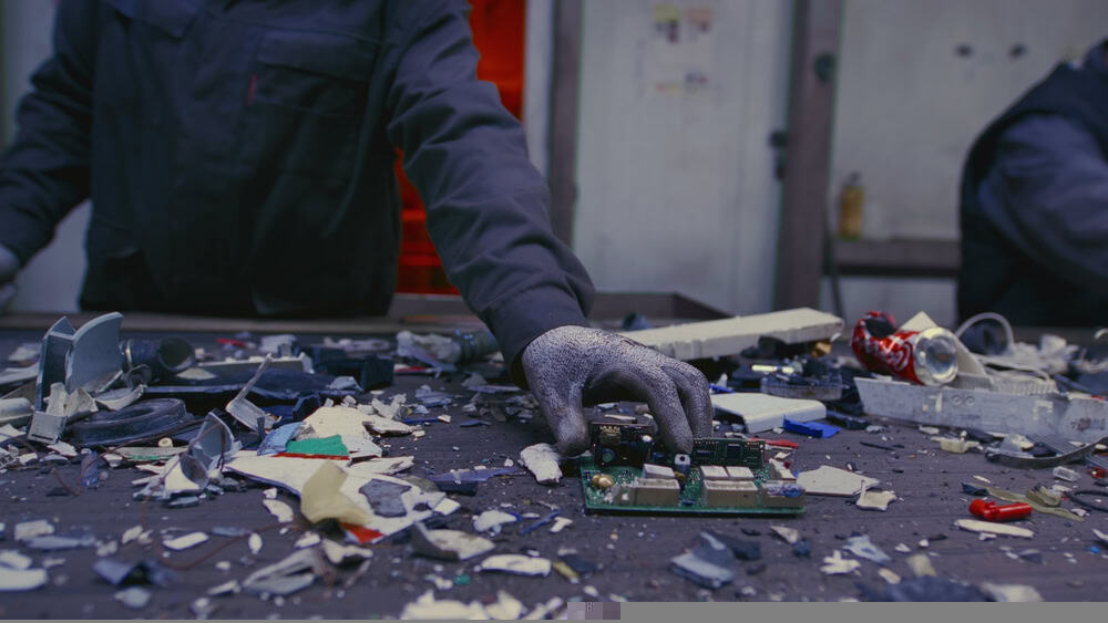 Person in front of a table with lots of materials on it
