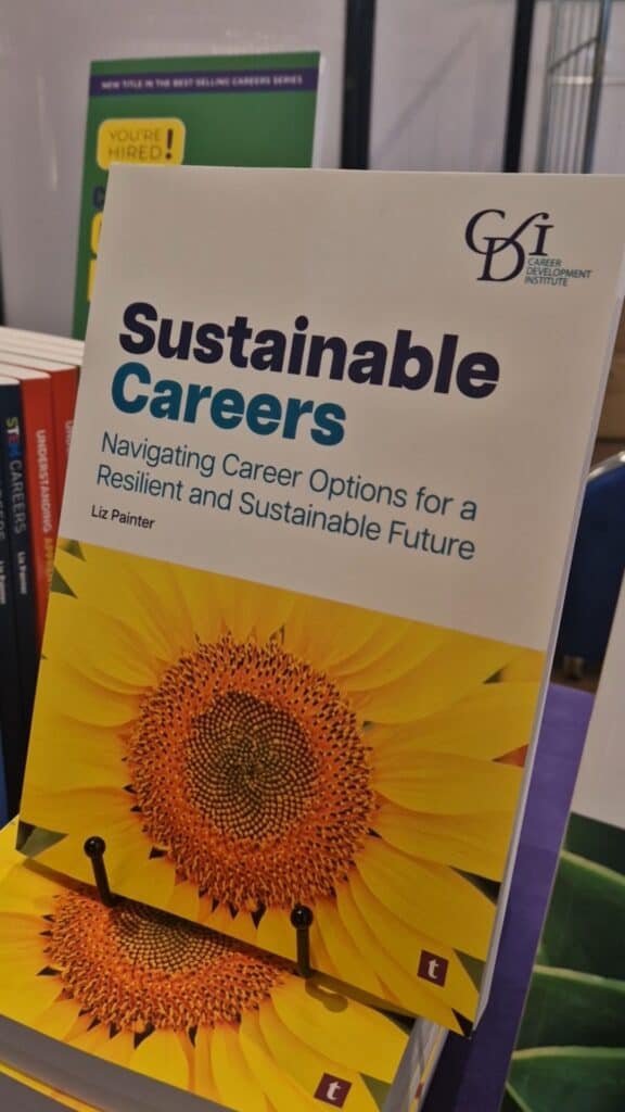 Picture of Liz Painter's book, titled: 'Sustainable Careers: Navigating Career Options for a Resilient and Sustainable Future', on display at a conference